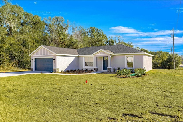 ranch-style house featuring a garage and a front yard