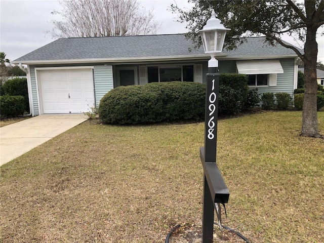 view of front of house with a garage and a front yard