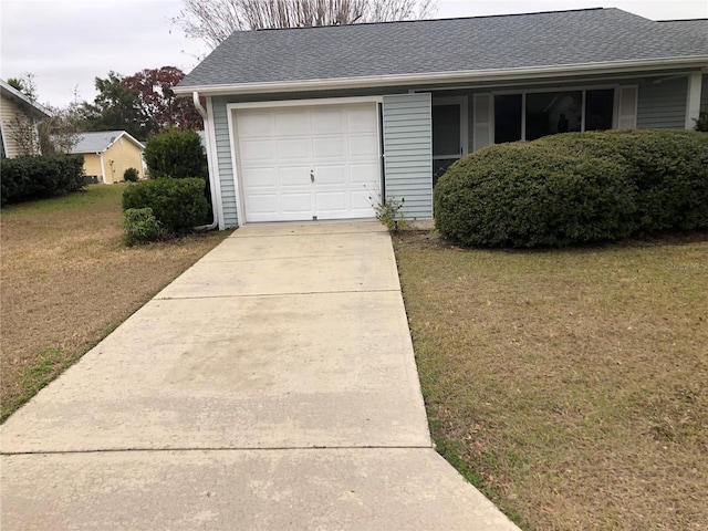 garage featuring a lawn