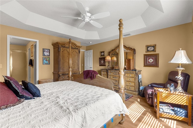 bedroom with a tray ceiling