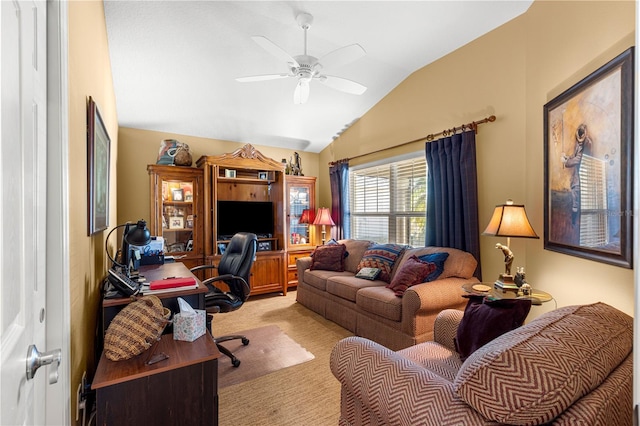 office space with ceiling fan, vaulted ceiling, and light carpet