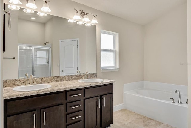 bathroom featuring vanity, shower with separate bathtub, and tile patterned flooring