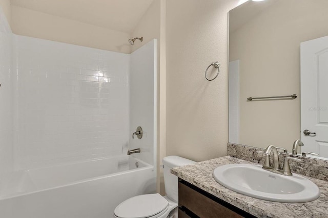 full bathroom with vanity, toilet, and  shower combination