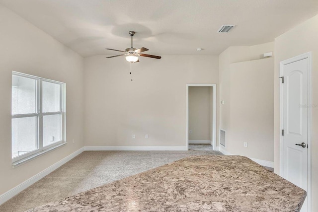 carpeted empty room with ceiling fan