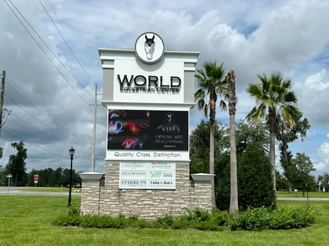 community / neighborhood sign with a lawn