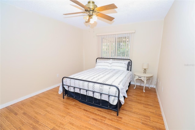 bedroom featuring ceiling fan and light wood-type flooring