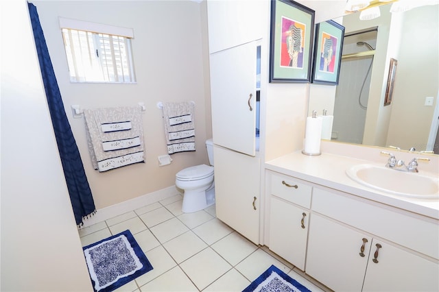 bathroom featuring vanity, curtained shower, tile patterned floors, and toilet