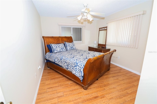 bedroom featuring light hardwood / wood-style flooring and ceiling fan