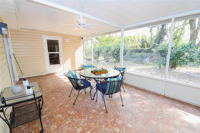 sunroom / solarium with ceiling fan