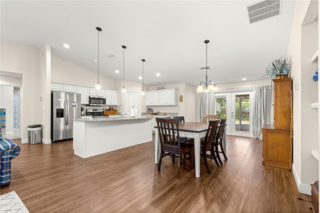 dining area with french doors, sink, high vaulted ceiling, dark hardwood / wood-style flooring, and a notable chandelier