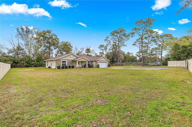 view of front of house featuring a garage and a front yard