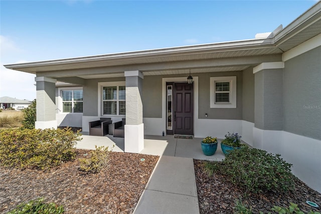 doorway to property with a porch