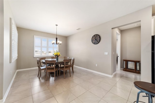 dining area featuring an inviting chandelier and light tile patterned floors