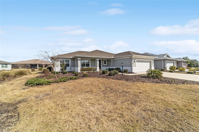 ranch-style house with a garage and a front lawn