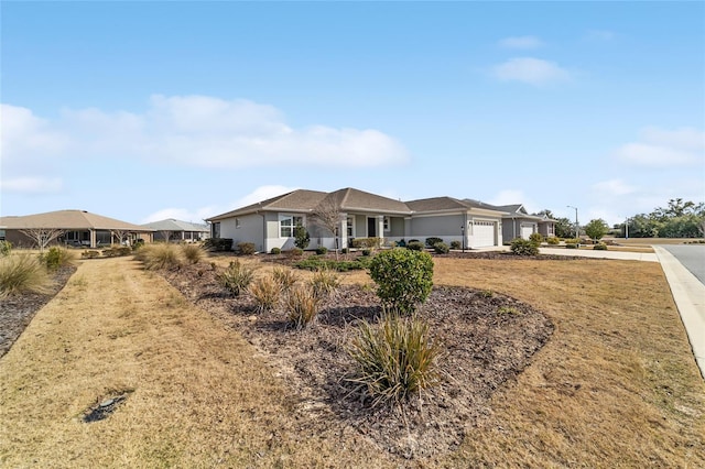 ranch-style house with a garage and a front yard