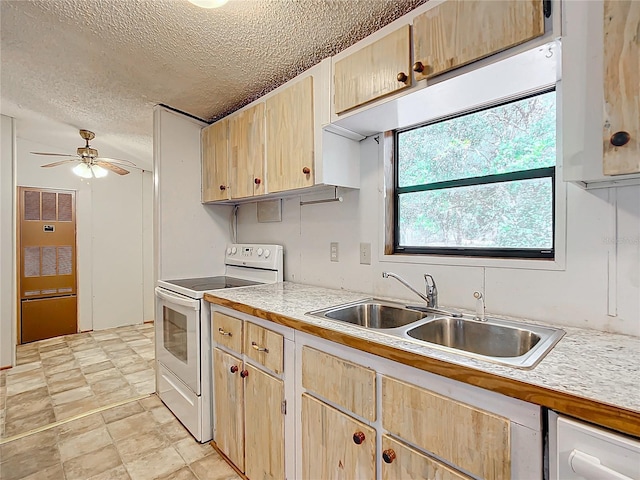 kitchen featuring light brown cabinetry, white electric stove, sink, ceiling fan, and a textured ceiling