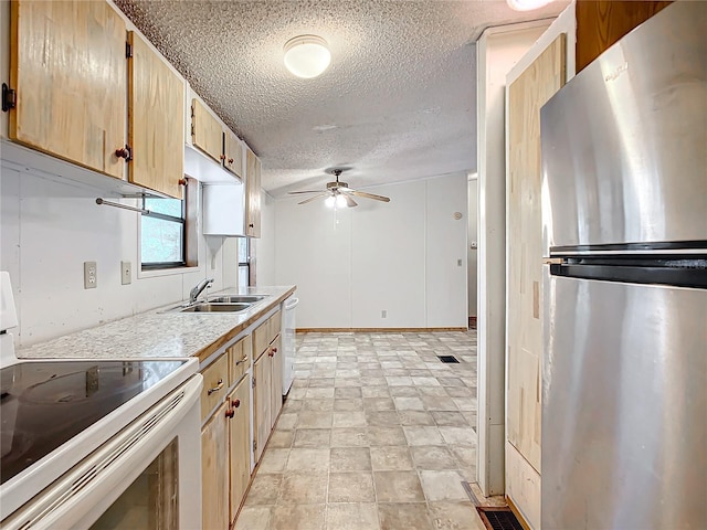 kitchen featuring sink, white appliances, ceiling fan, a textured ceiling, and light brown cabinets