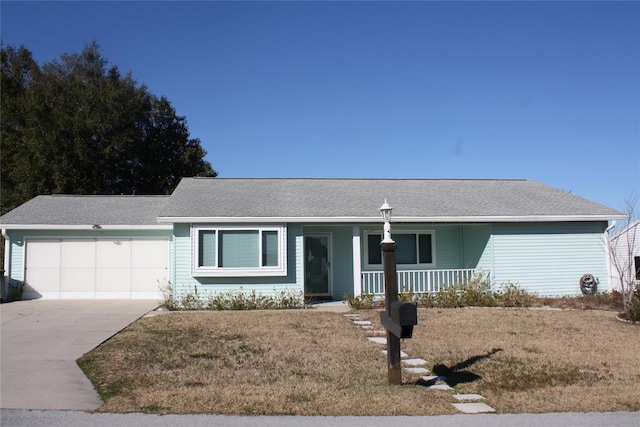 ranch-style house featuring a garage, a front lawn, and covered porch