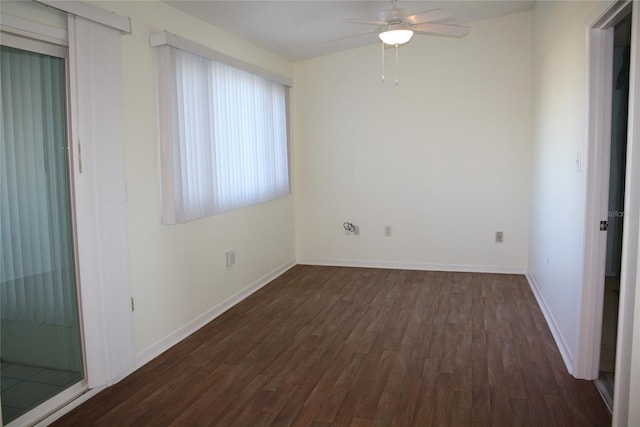 spare room with ceiling fan and dark hardwood / wood-style floors