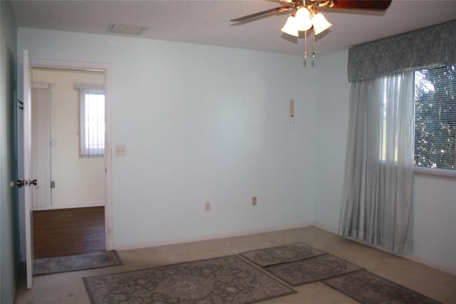 spare room with ceiling fan