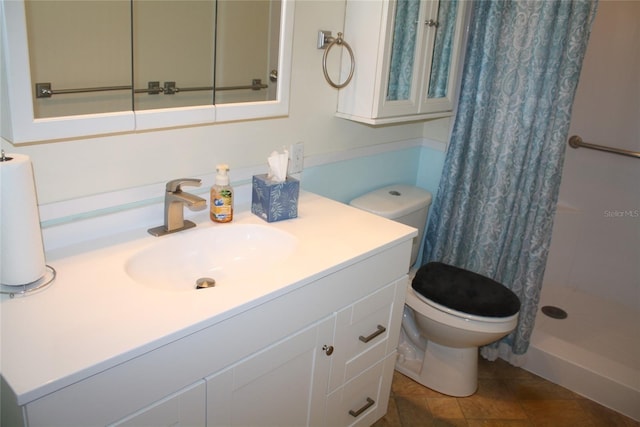 bathroom with vanity, toilet, and a shower with shower curtain