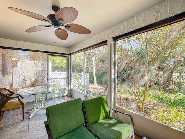 sunroom / solarium with plenty of natural light and ceiling fan