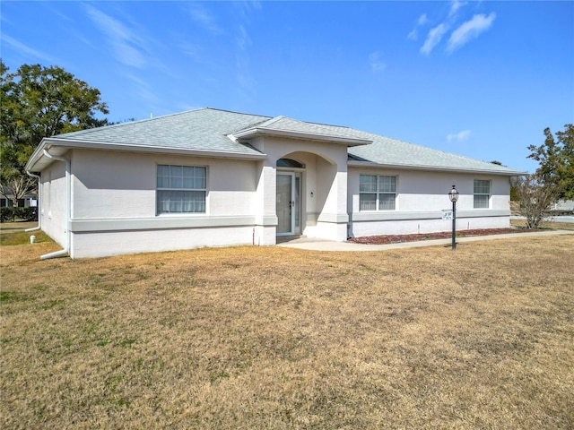 view of front of home featuring a front yard