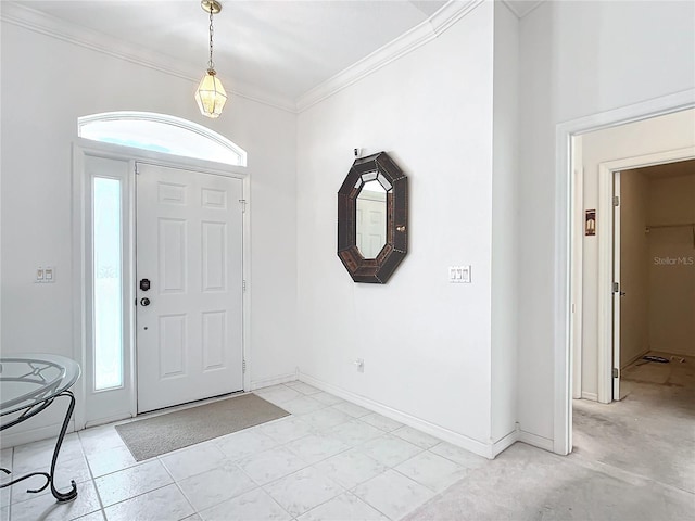 entryway featuring ornamental molding and a wealth of natural light