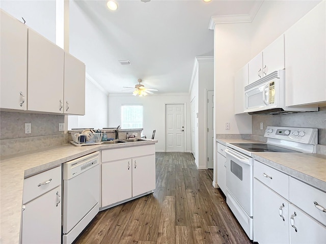 kitchen with sink, white cabinetry, crown molding, dark hardwood / wood-style flooring, and white appliances