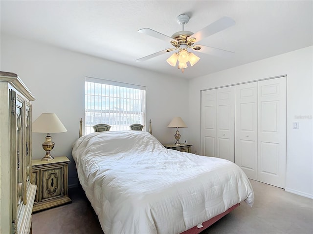 bedroom with ceiling fan, carpet flooring, and a closet