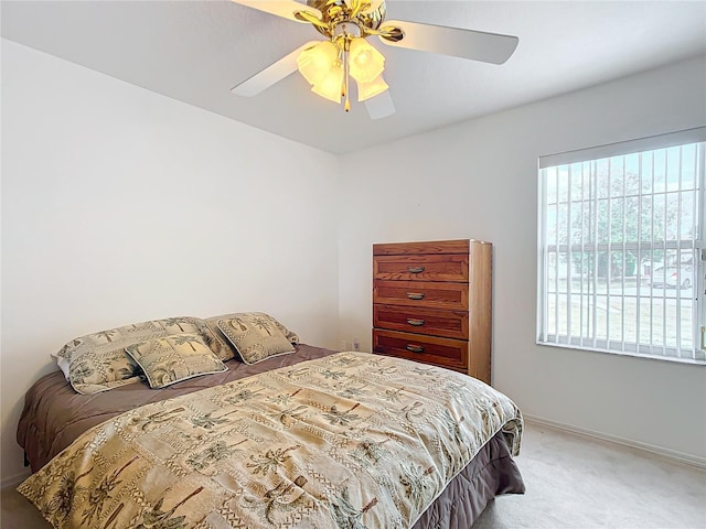 bedroom featuring ceiling fan and carpet floors