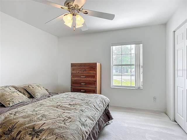 8574 SW 60th Ct, Ocala, FL 34476 - bedroom featuring baseboards, ceiling fan, and light colored carpet