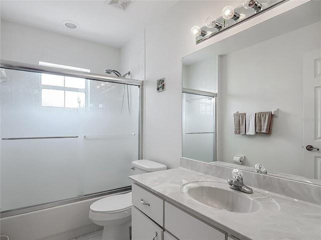 8574 SW 60th Ct, Ocala, FL 34476 - full bathroom featuring toilet, visible vents, enclosed tub / shower combo, and vanity