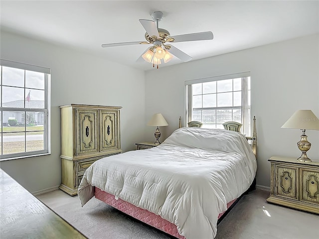 8574 SW 60th Ct, Ocala, FL 34476 - bedroom with a ceiling fan, light carpet, and baseboards