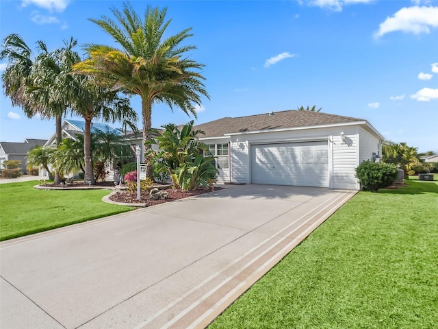 view of front of home with a garage and a front lawn