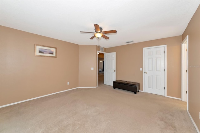 carpeted empty room with ceiling fan