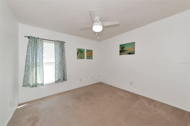 unfurnished room featuring carpet floors and ceiling fan