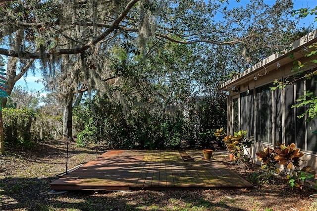 view of yard with a wooden deck