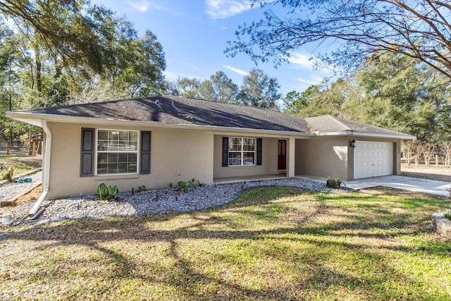 ranch-style home featuring a garage and a front yard