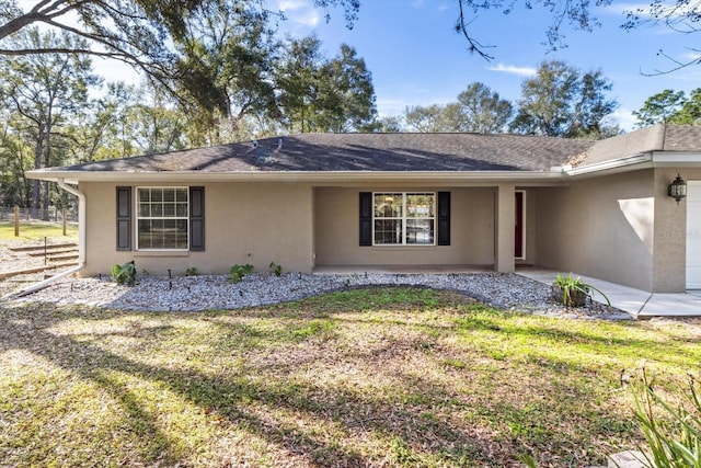 single story home with a front yard