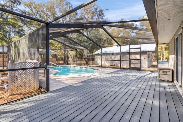 view of swimming pool with glass enclosure