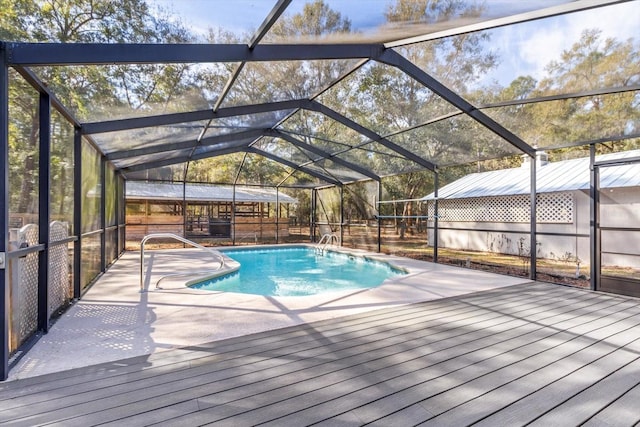 view of pool with a lanai and a patio area