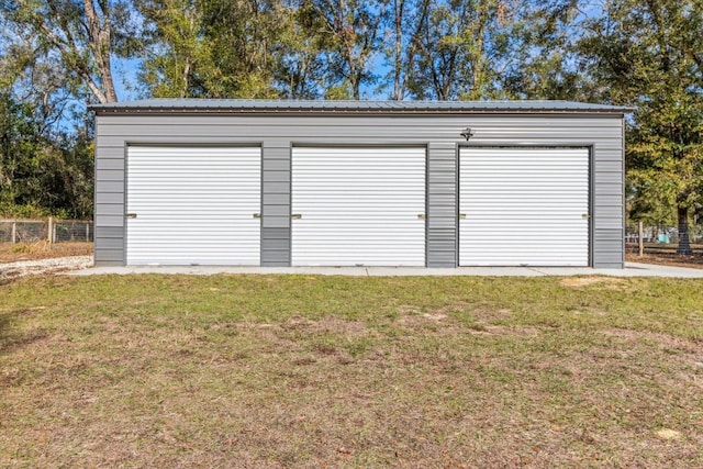 garage with a lawn