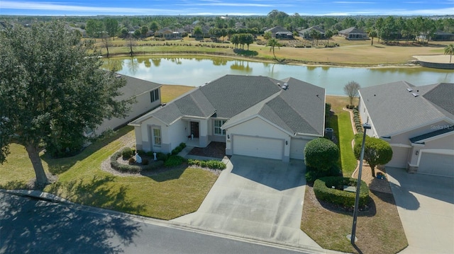 birds eye view of property with a water view