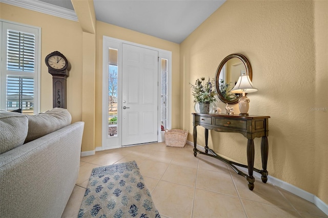 entrance foyer with light tile patterned floors and vaulted ceiling