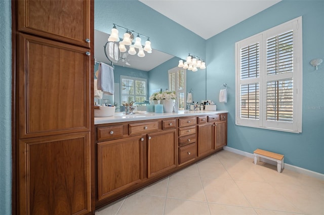 bathroom with tile patterned floors and vanity