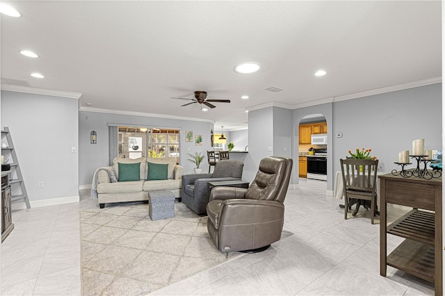 living room with a textured ceiling, ornamental molding, and ceiling fan