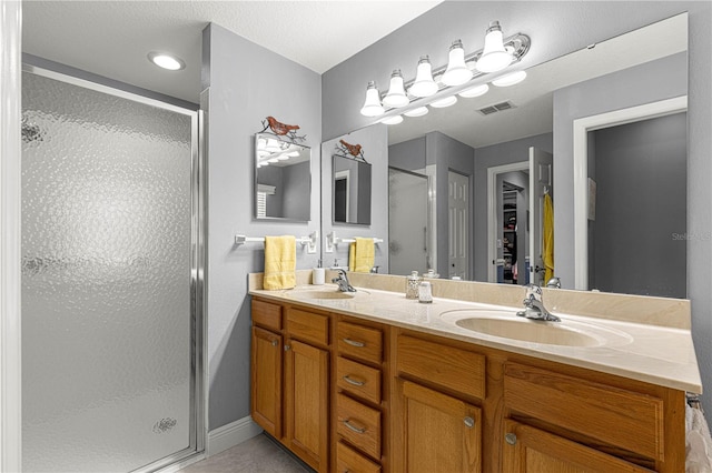 bathroom featuring vanity and walk in shower