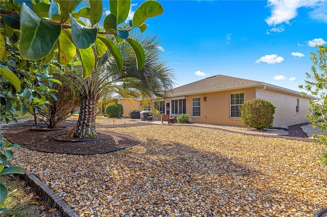 back of house with a patio