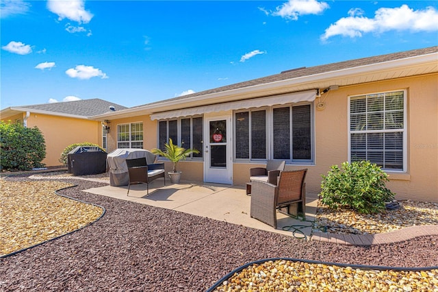 rear view of property featuring a patio